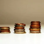 Simple Interest vs Compound Interest: Key Differences Explained Stacked coins showing financial growth from simple interest vs compound interest